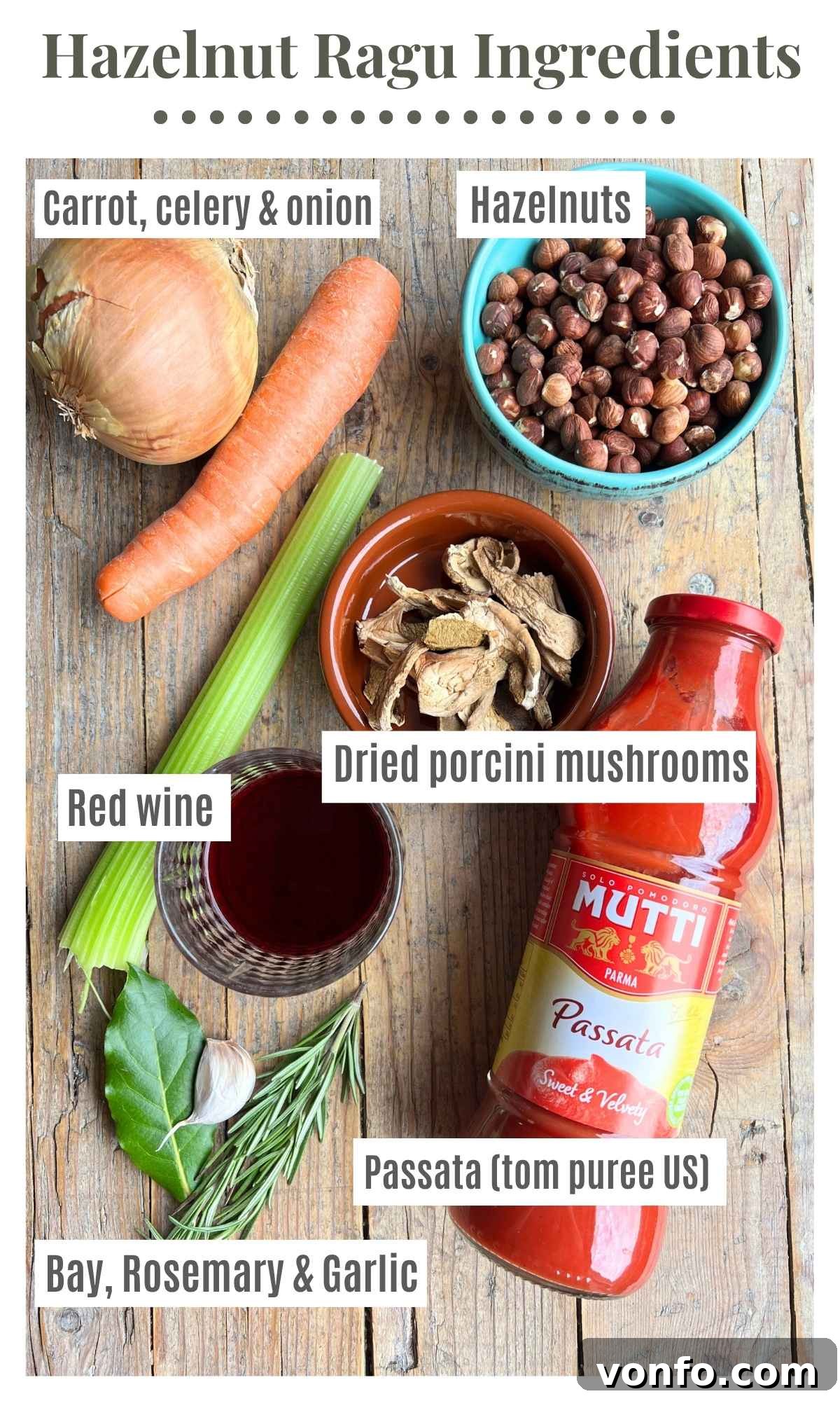 Piedmontese Hazelnut Ragu: A Rustic Italian Delight 3 An overhead shot showcasing all the essential ingredients for making a delicious hazelnut ragu, neatly arranged on a rustic surface. Ingredients include whole hazelnuts, chopped carrot, celery, and onion (soffritto), a jar of passata (US tomato puree), a bottle of red wine, fresh bay leaves, rosemary sprigs, garlic cloves, and dried porcini mushrooms.
