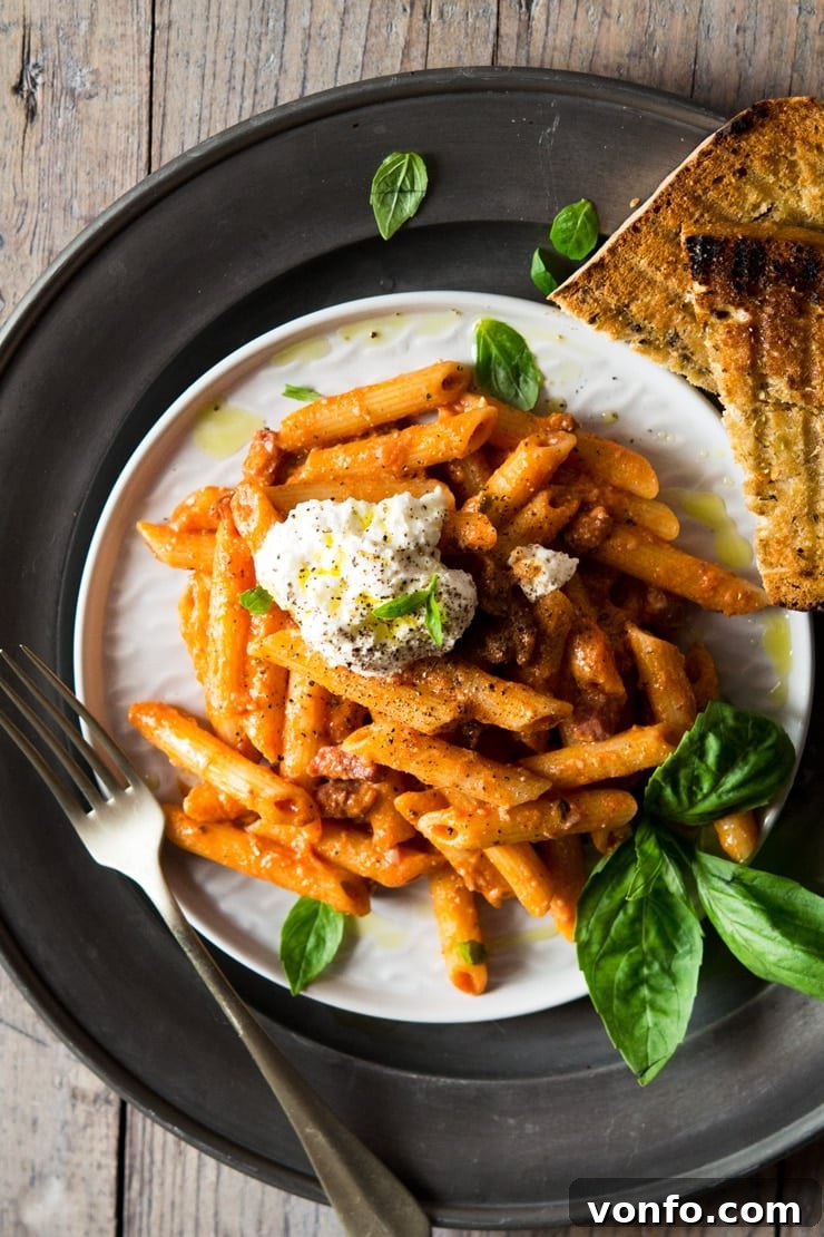 Penne pasta with pancetta, ricotta, and basil A plate of penne pasta with crispy pancetta, dollops of fresh ricotta, and fragrant basil leaves, showcasing a perfect blend of textures and colors.