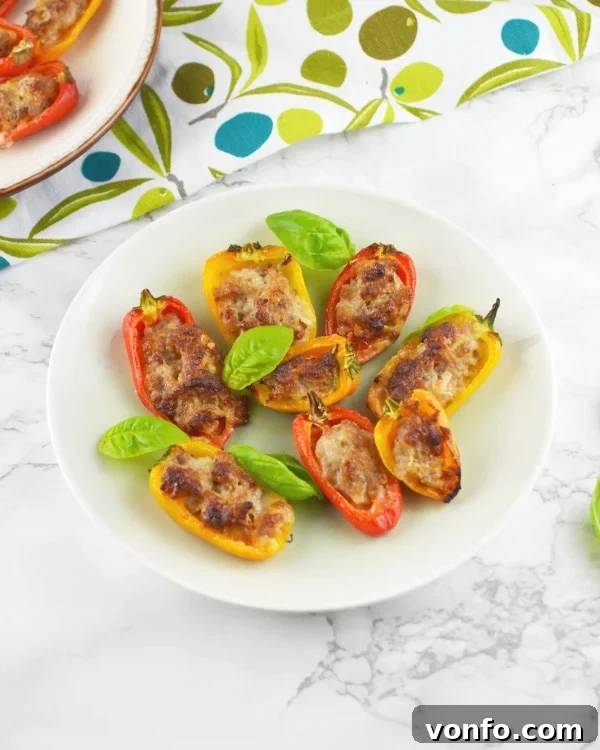 Delicious Sausage and Stracchino Stuffed Sweet Mini Peppers, ideal for an Italian antipasto Sausage and Stracchino stuffed sweet mini peppers, a perfect Italian appetizer