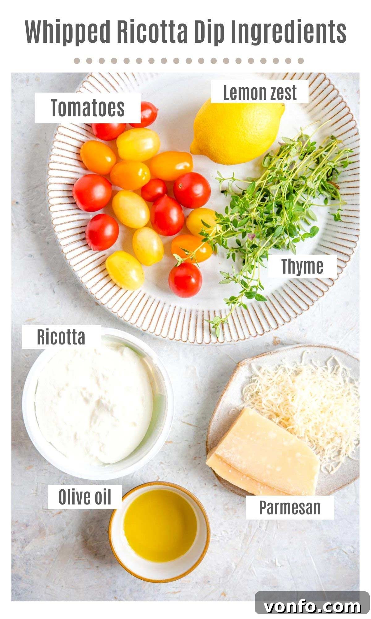 An overhead shot of all the fresh ingredients needed to make a delicious whipped ricotta dip with roasted tomatoes