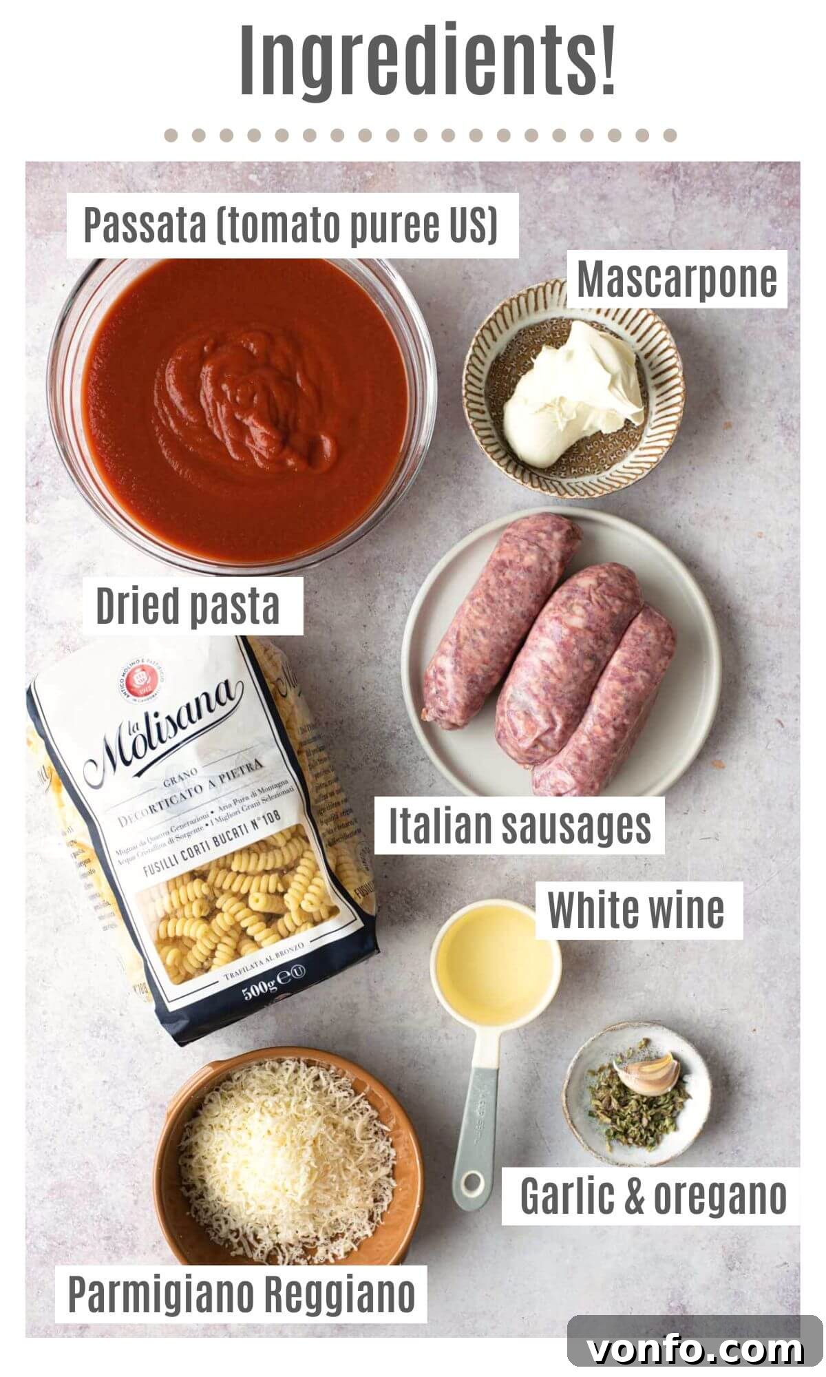 Velvety Tomato Pasta with Hearty Italian Sausage 3 An overhead shot of ingredients needed to make creamy tomato sausage pasta, including passata, mascarpone, dried pasta, Italian sausages, white wine, Parmigiano Reggiano, garlic, and oregano.