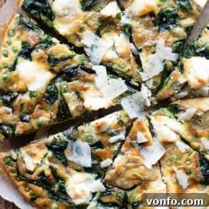 A square image of the finished Easy Spinach and Artichoke Frittata, golden and inviting.
