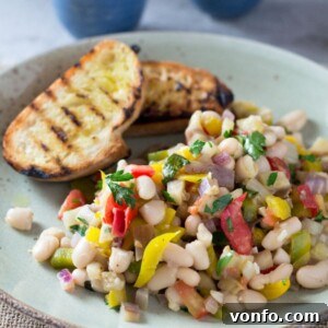A beautifully presented warm easy bean salad, ready to be served. A healthy, simple, and delicious summer recipe.
