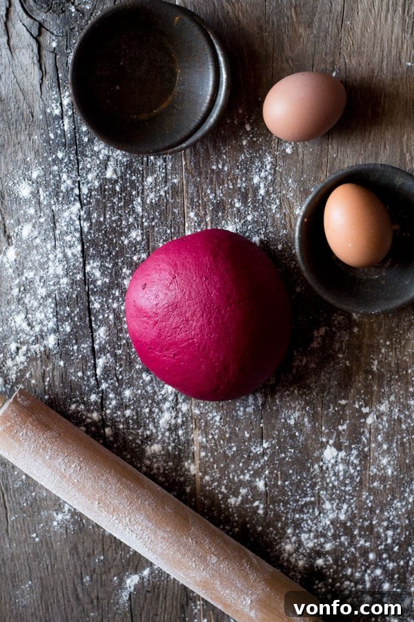 Vibrant pink beetroot pasta dough ready for shaping