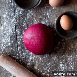 A ball of bright pink beetroot pasta dough