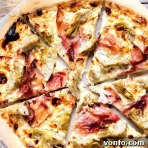 A close up of an artichoke pizza