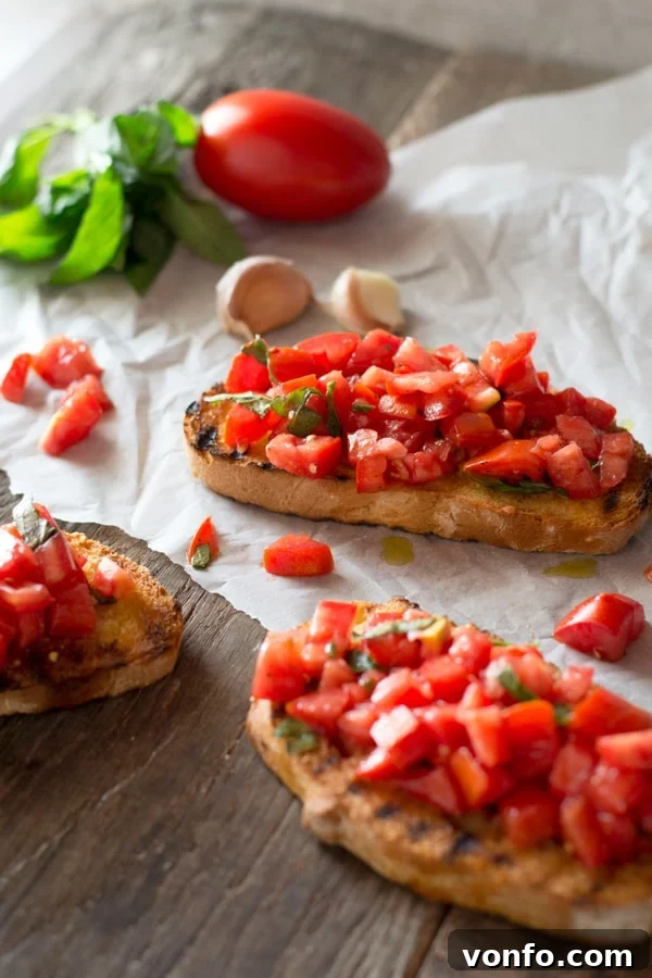 Bruschetta al Pomodoro: Fresh Tomato, Basil, and Garlic on Toasted Rustic Bread Classic Italian Bruschetta al Pomodoro featuring freshly chopped tomatoes, basil, and garlic on toasted bread, artfully arranged on a wooden board with fresh ingredients in the background.