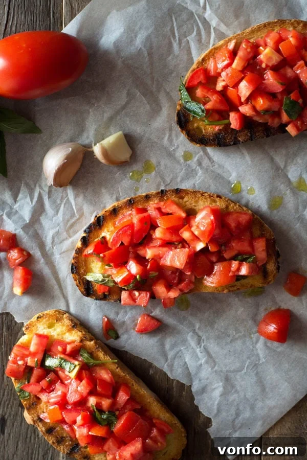 Classic Bruschetta al Pomodoro on Char-Grilled Bread Three perfectly assembled slices of Bruschetta al Pomodoro, featuring char-grilled rustic bread topped with a vibrant mixture of chopped fresh tomatoes and basil, presented on a wooden surface.
