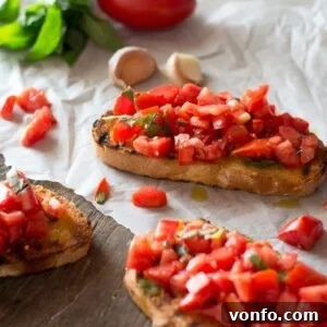 Bruschetta al pomodoro - classic Italian tomato bruschetta recipe made with ripe, juicy tomatoes, fresh basil and extra virgin olive oil. Served on char grilled, garlic toasts, this one is always a winner! Inside the rustic kitchen