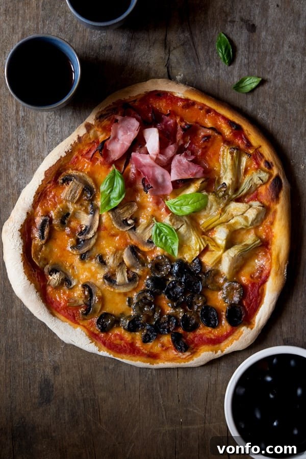 Delicious Quattro Stagioni pizza with four distinct sections of toppings