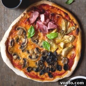 An overhead shot of a perfectly baked Quattro Stagioni pizza, ready to serve