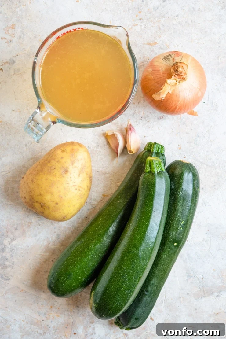 Creamy Italian Potato and Zucchini Soup - An easy soup that's comforting, warming and packed full of flavour. Healthy, delicious and easy comfort food the whole family will love. #zucchini #soup #comfortfood An overhead shot of ingredients used to make creamy zucchini soup