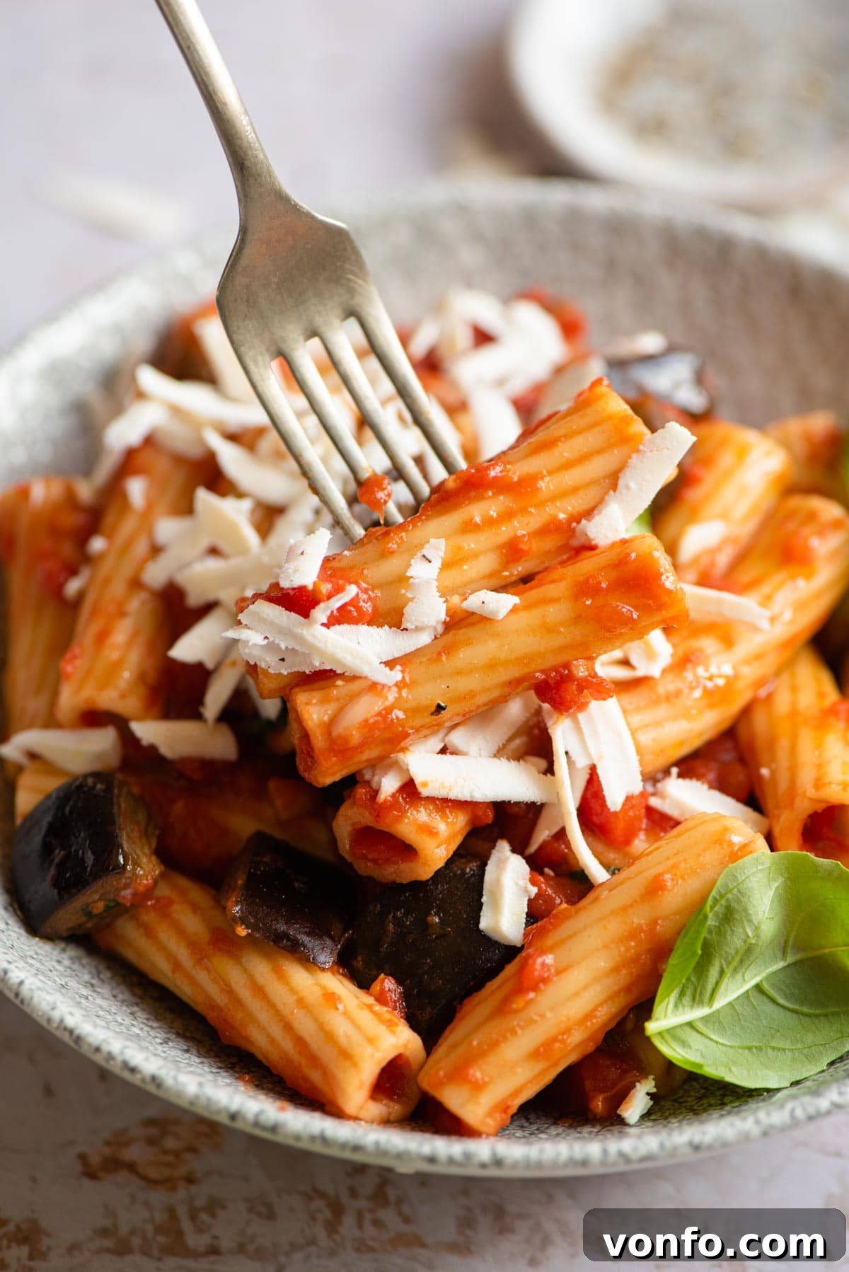 Classic Sicilian Eggplant Pasta 6 A close up of eggplant pasta on a fork
