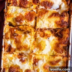 A square image of a baked lasagne al forno, golden and inviting