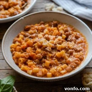 A delicious bowl of Pasta Fagioli Soup, captured from above, showing its rich texture and hearty ingredients.