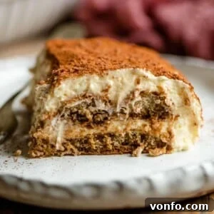 A xlose up of a slice of Tiramisu on a plate