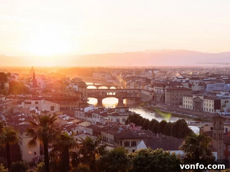 A photo of the city of Florence and the Ponte Vecchio at sunset A breathtaking photo of the iconic city of Florence and the historic Ponte Vecchio bridge, beautifully illuminated against the warm, vibrant colours of a sunset sky.