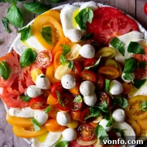 Fresh Caprese: Effortlessly Delicious 2 An overhead shot of a caprese salad with vibrant coloured tomatoes