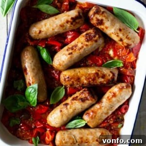 Close up of an Italian Sausage Bake with tomatoes and herbs