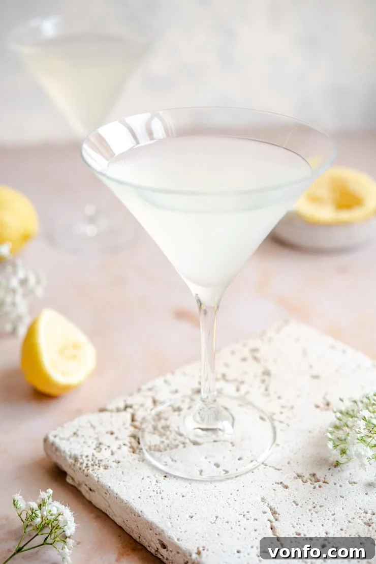 Side shot of a Limoncello Martini garnished with a lemon twist