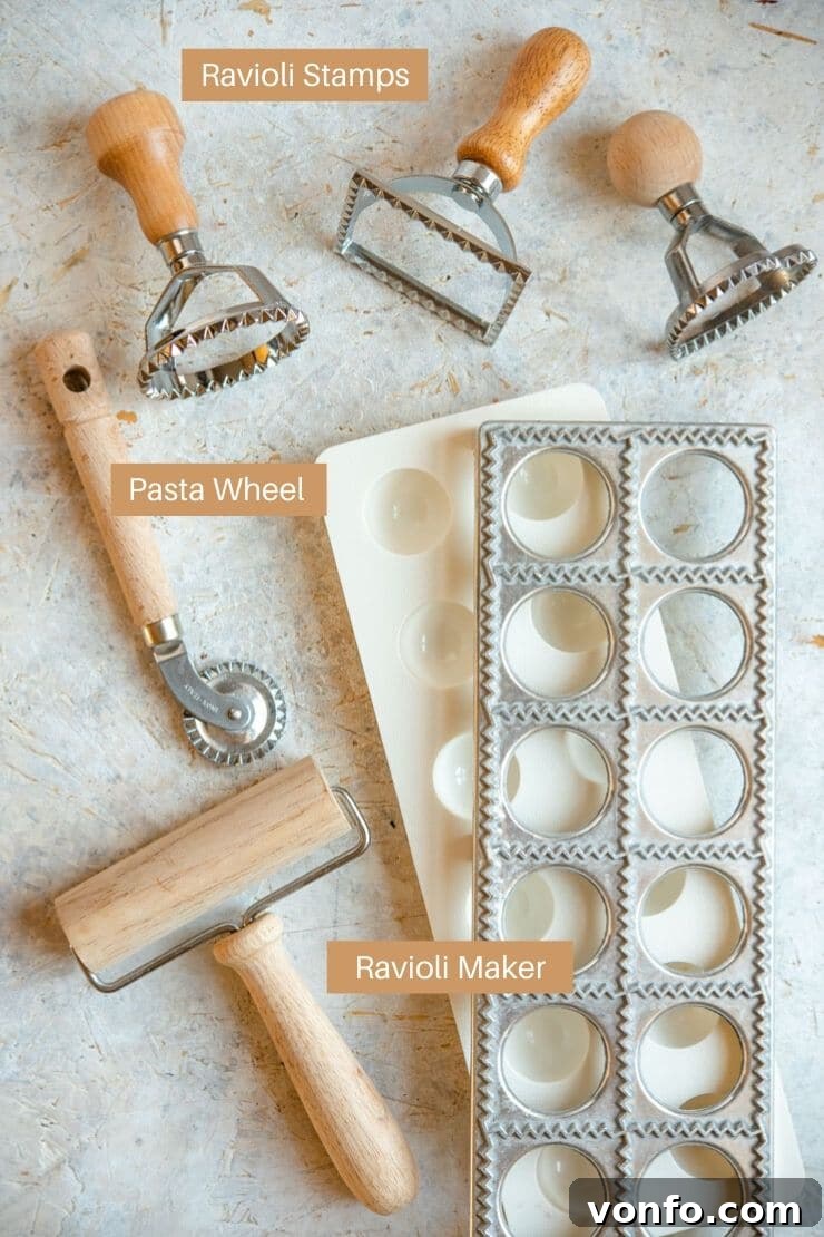 Understanding the essential tools for homemade ravioli. A collection of pasta tools including a ravioli wheel, stamps, and a ravioli maker, laid out on a clean surface.