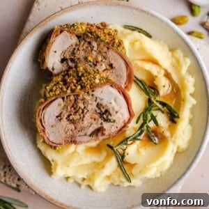 Prosciutto-Pistachio Stuffed Pork Tenderloin 2 A perfectly roasted slice of stuffed pork tenderloin with its savory filling and pistachio crust.