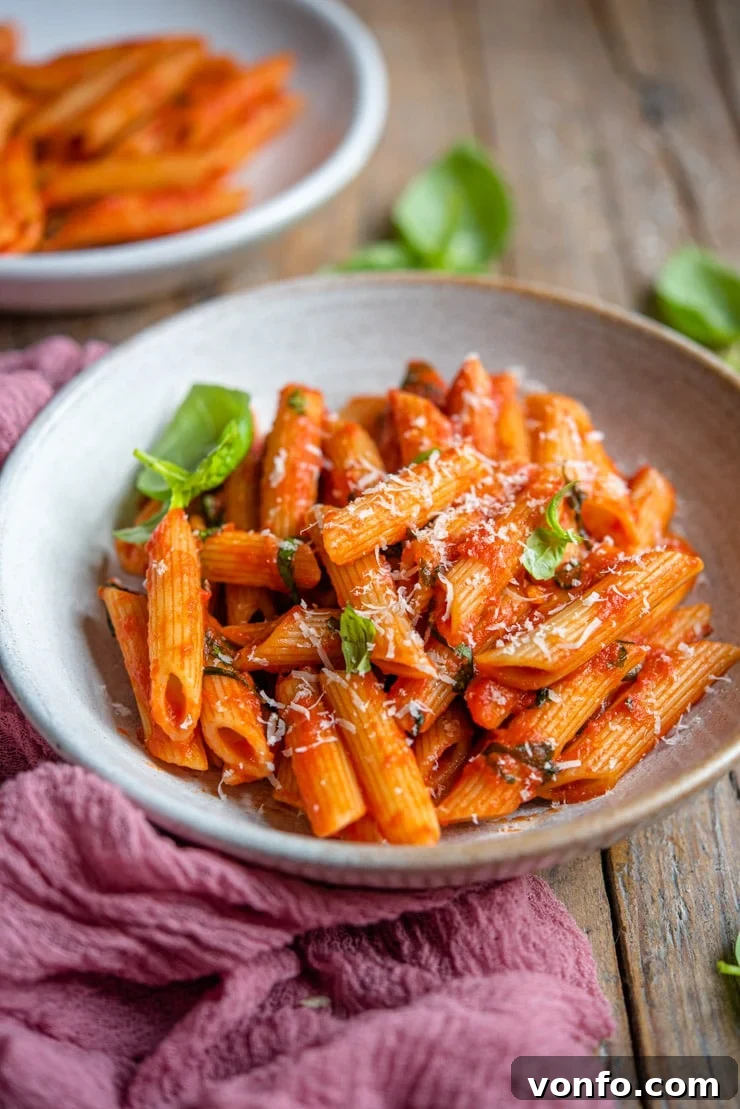 Step-by-step photo 2: Combining pasta with the pomodoro sauce and fresh basil