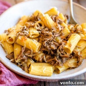 A square image of Genovese Sauce with rigatoni pasta, beautifully coated and ready to be served.