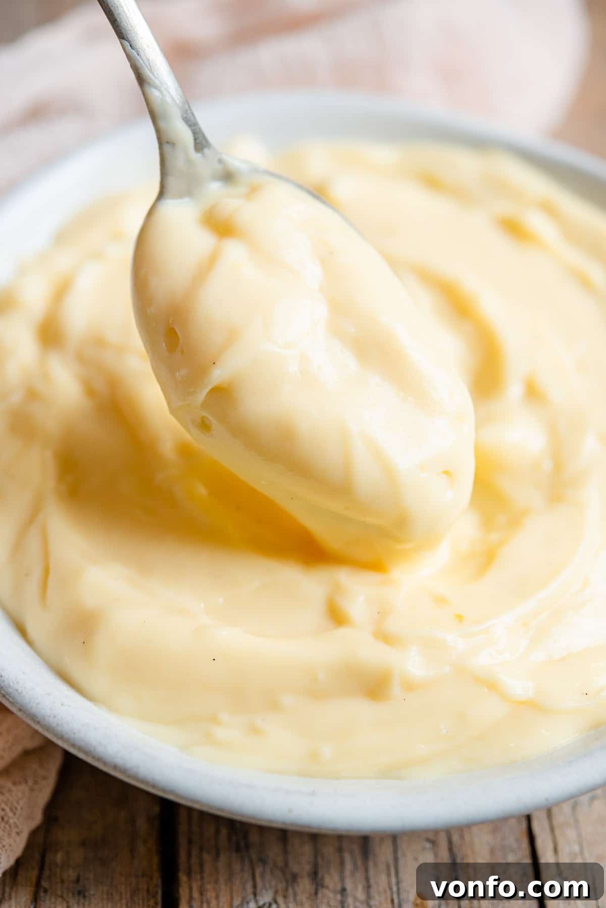 Crema Pasticcera Authentic Italian Pastry Cream 7 A close up of a spoonful of perfectly smooth and creamy Italian pastry cream.