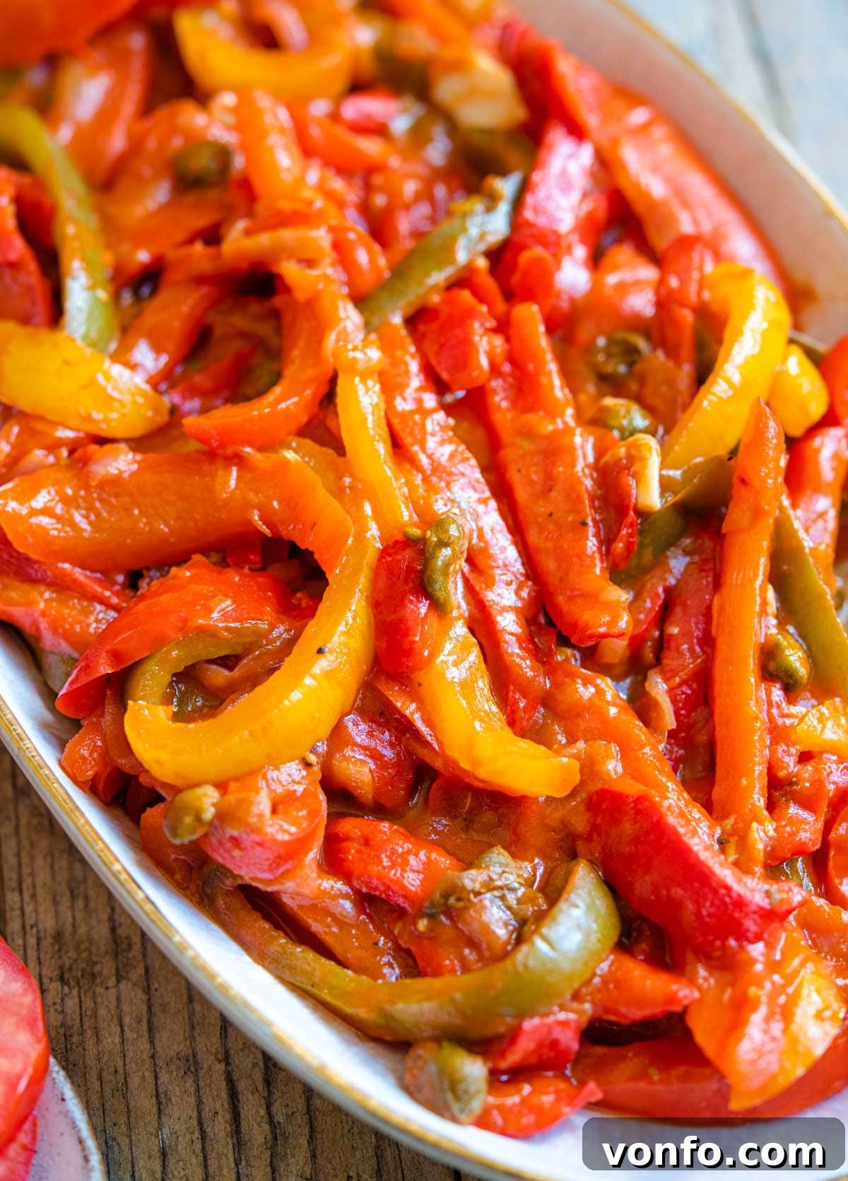 Peperonata: Sweet Bell Peppers in Rich Tomato Sauce 3 A close up of the texture of slow-cooked bell peppers in tomato sauce, ready to be served.