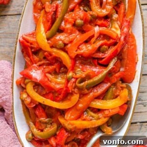 Peperonata: Sweet Bell Peppers in Rich Tomato Sauce 7 Peppers in tomato sauce on a serving plate