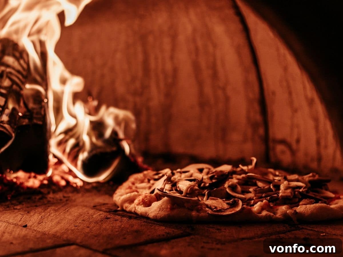A close-up shot of a delicious pizza baking inside a traditional wood-fired pizza oven, with visible flames gently charring the crust.