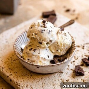 A square image of 3 scoops of stracciatella gelato in a rustic dish