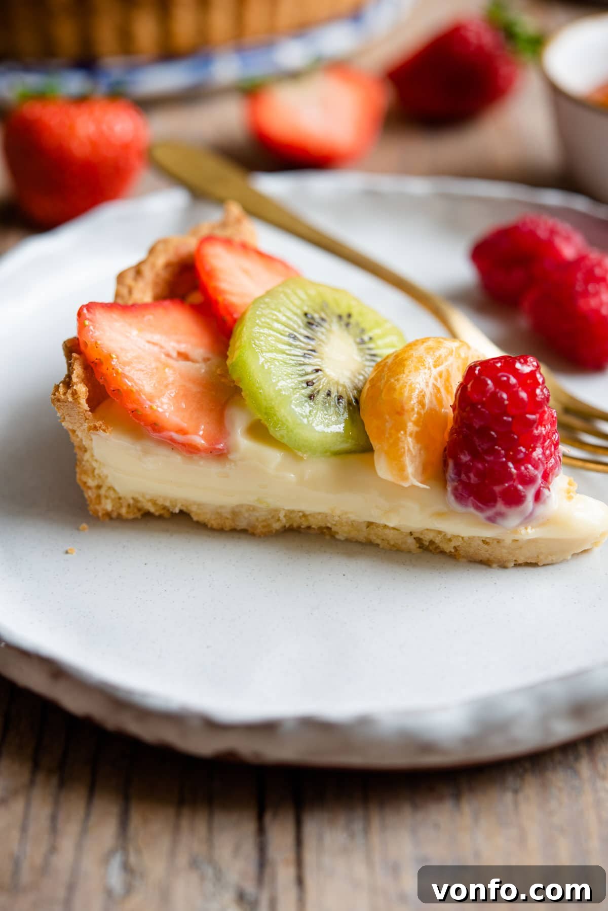 Italian Harvest Fruit Tart 12 A slice of tart filled with pastry cream and fresh fruit
