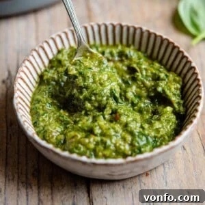 A square image of vibrant Italian salsa verde in a ramekin, ready to be served.