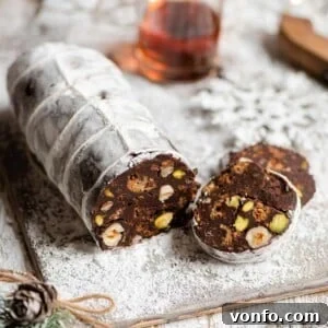 A close up of a chocolate salami cut into slices