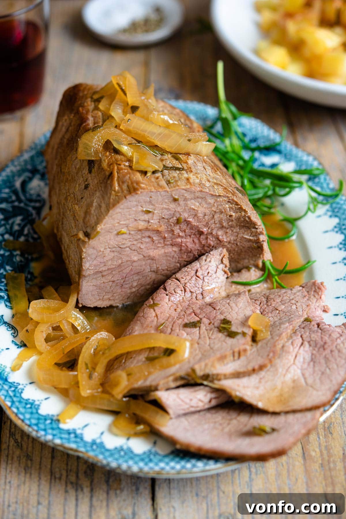 Tender Italian Roast Beef with Marsala and Caramelized Onions 2 Platter of juicy Italian roast beef slices with rich marsala onion gravy