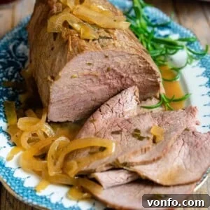 A close up of roast beef on a plate
