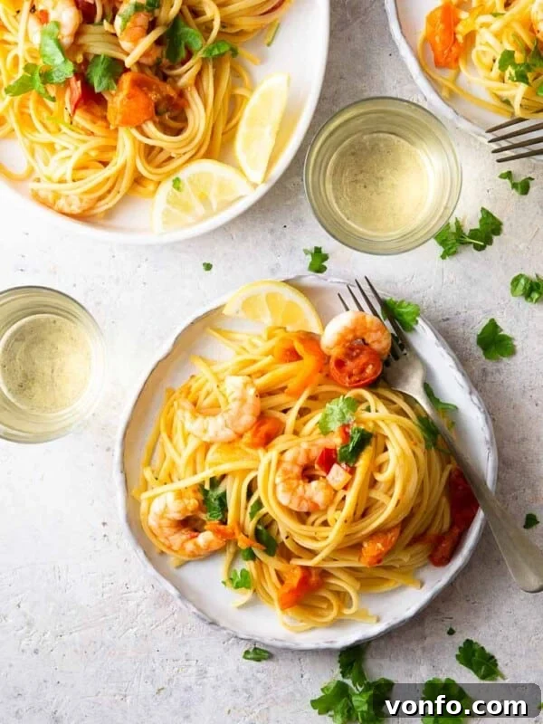 An overhead shot of shrimp linguine on a plate with parsley