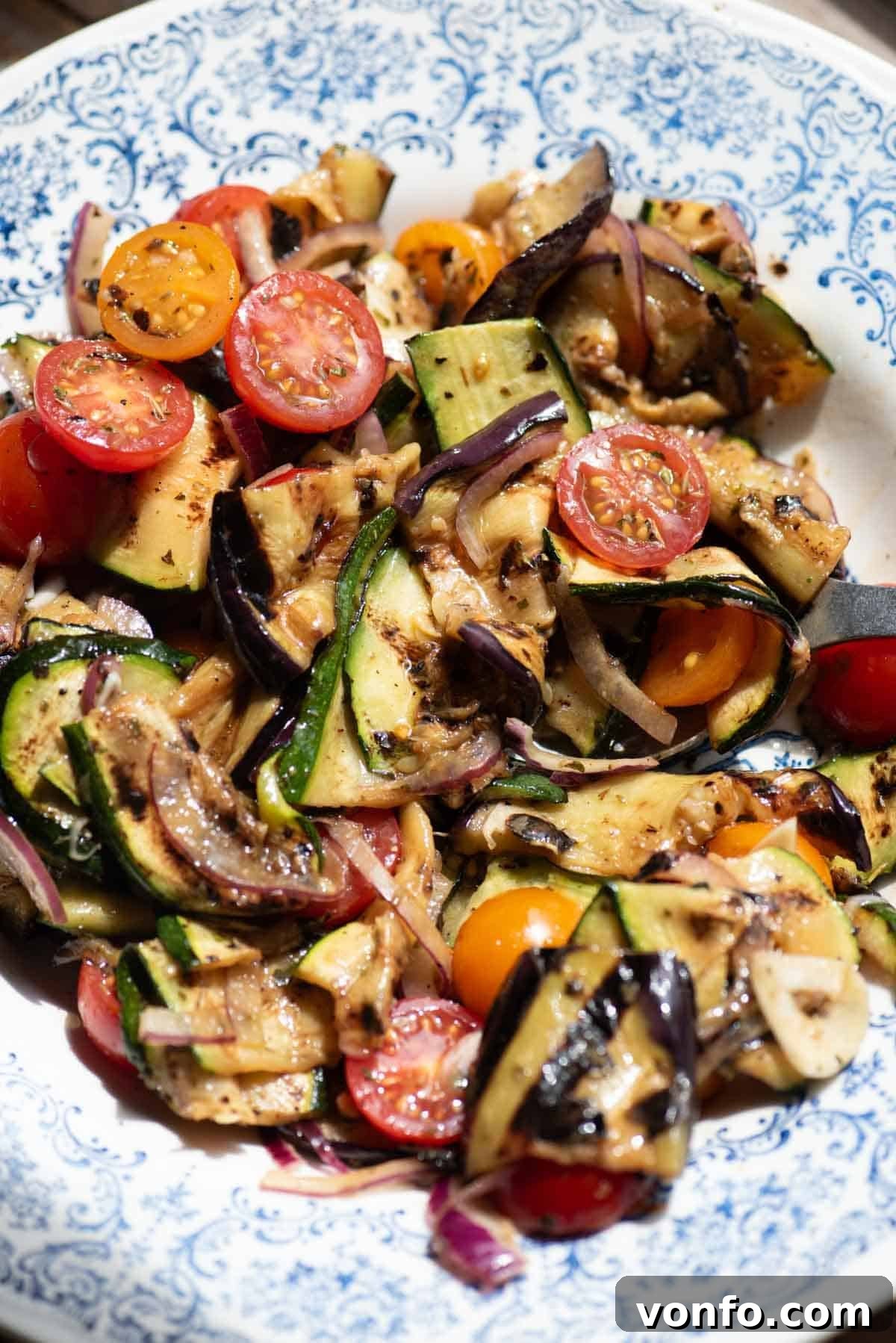 Italian Summer Vegetable Marinade Recipe for Fresh Antipasti 4 A close up of marinated grilled vegetables in a bowl.