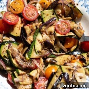 Italian Summer Vegetable Marinade Recipe for Fresh Antipasti 9 A close up of marinated summer vegetables in a bowl.
