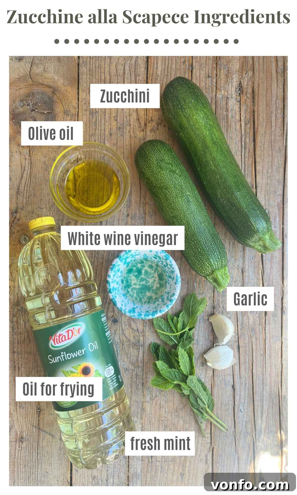 Neapolitan Zucchine alla Scapece: Fried Marinated Zucchini 3 An overhead shot of all the ingredients needed to make zucchine alla scapece on a wooden board.