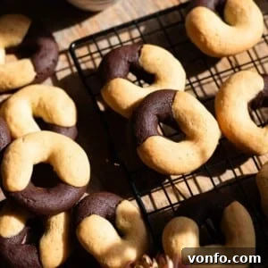A close up cropped image of Italian abbracci cookies on a cooling rack.