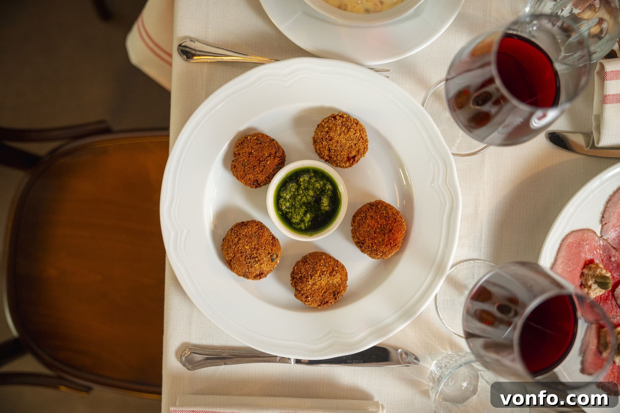 Inside Lombardy: Gianmarco Senna on Politics and Plans 3 Mondeghili on a plate in a restaurant.