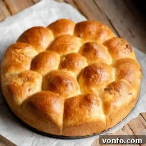 Danubio Salato: Neapolitan Savory Stuffed Brioche Buns 9 A cropped square image of a danubio salato on a rustic wooden surface.